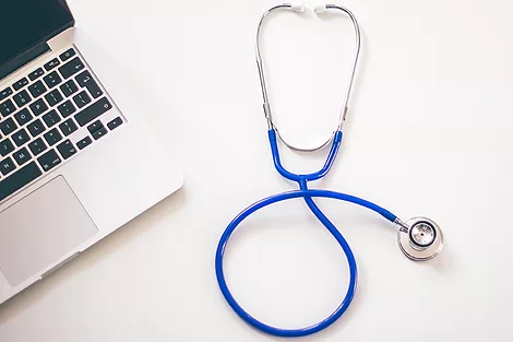 stethoscope and laptop