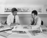 Black and white photo of Stan Laegreid and his colleague Steve Dwoskin working on drawings for projects based in Chile in the 1980s