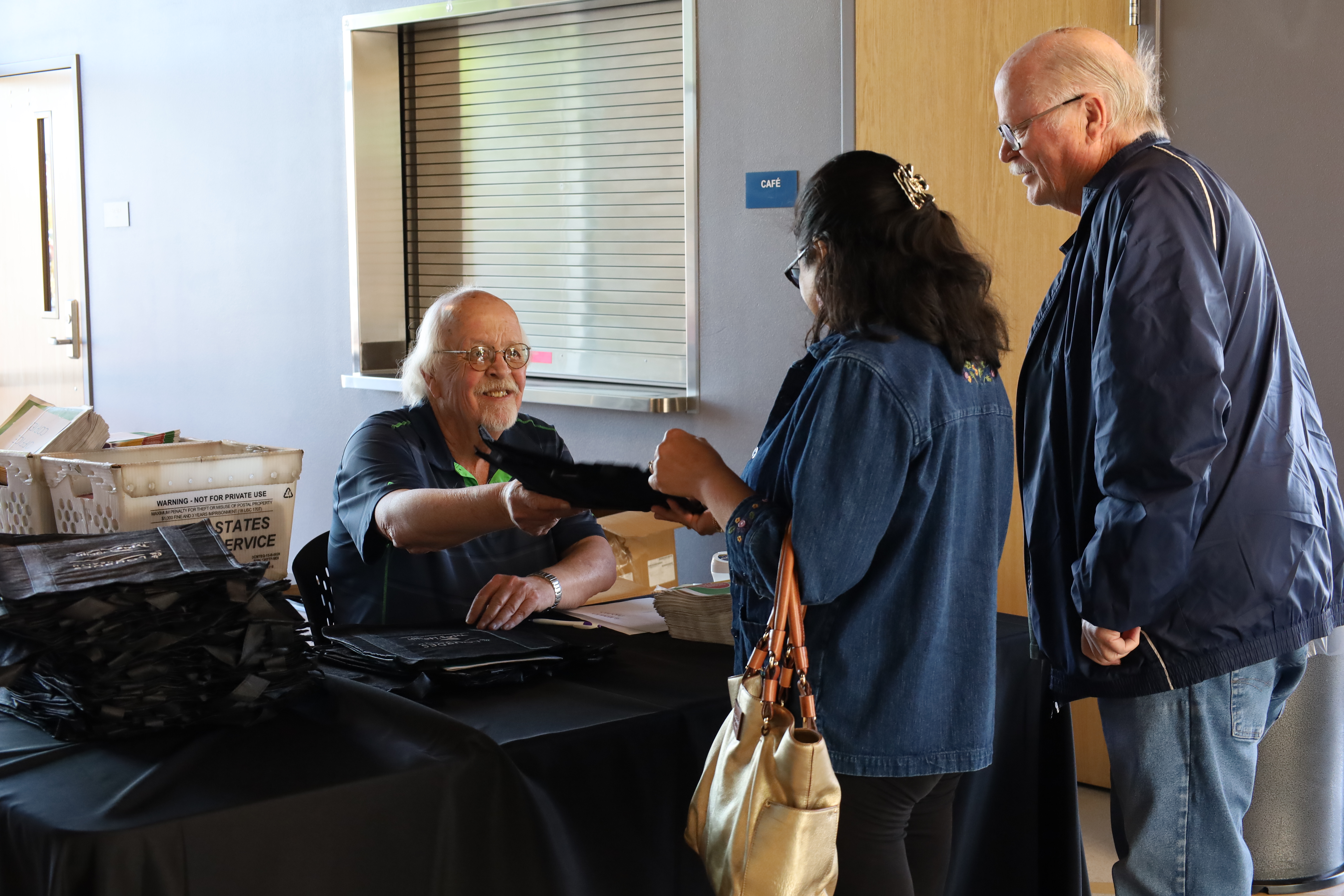 Randy handing out bags at the expo