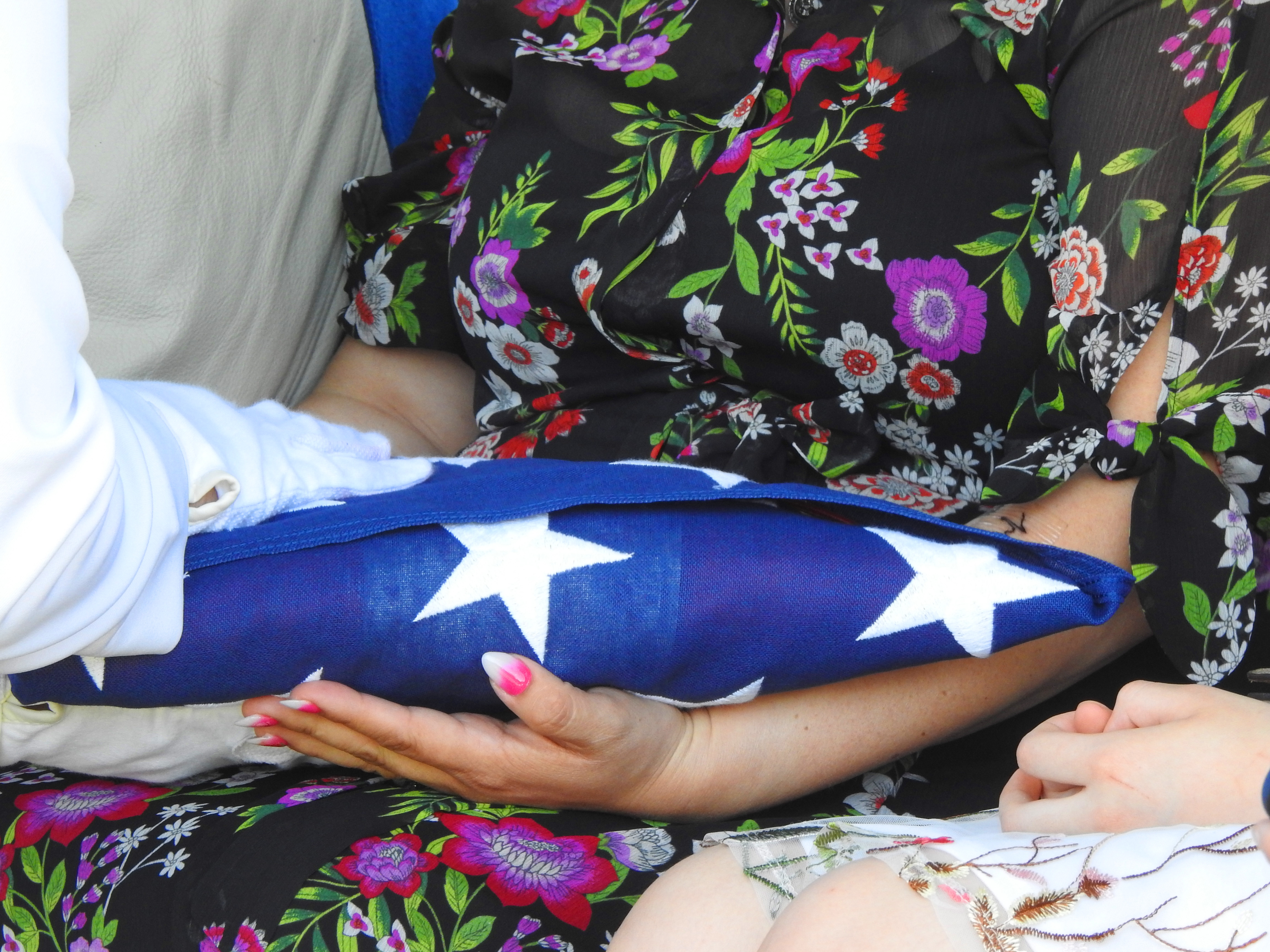 VFW flag presented to widow.