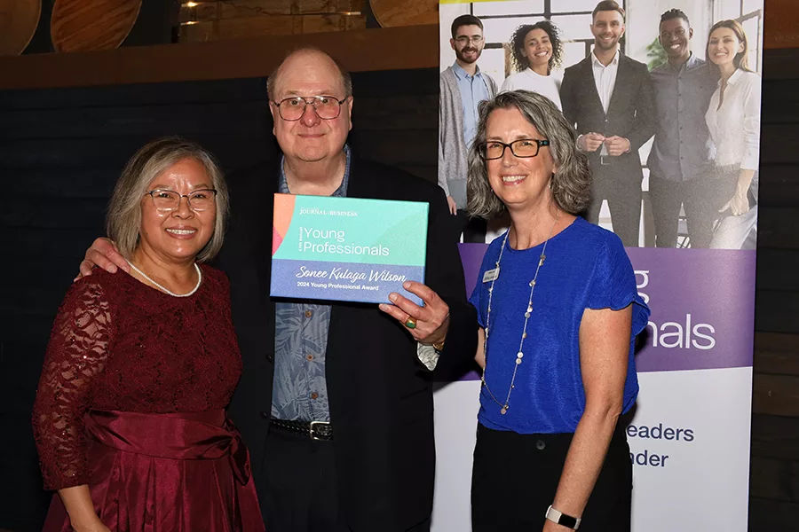 Sonee Kulaga Wilson's parents, Nang and Frank, accepted her award.