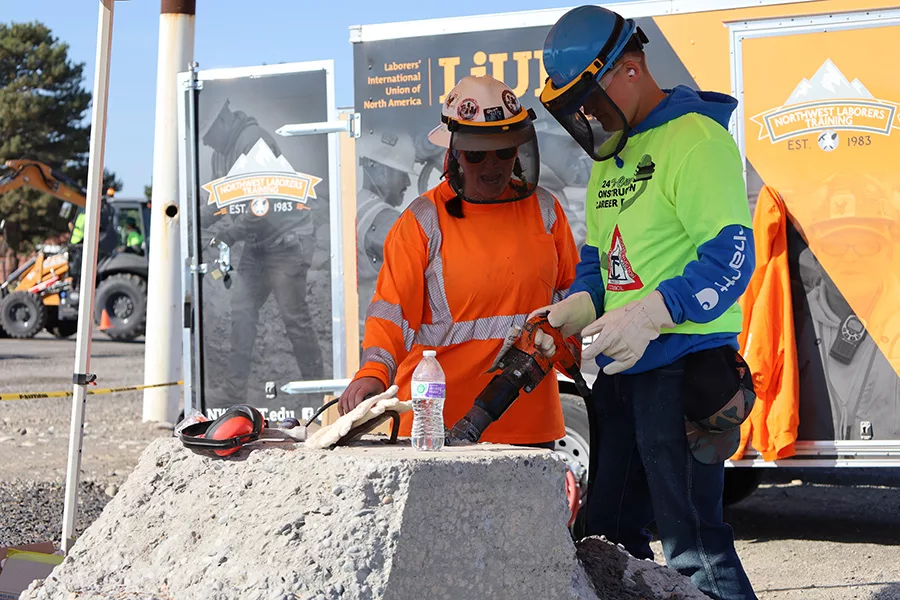 Student chiseling a concrete block