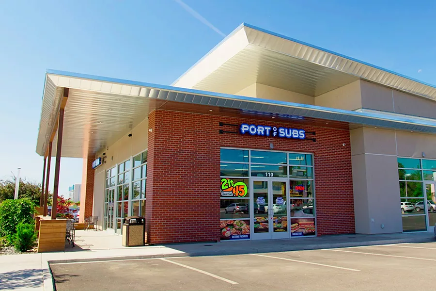 The exterior of a building that reads, "Port of Subs".