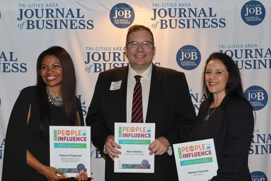 Chauné Fitzgerald, Matt Watkins and Diahann Howard posing in-front of a JOB backdrop.