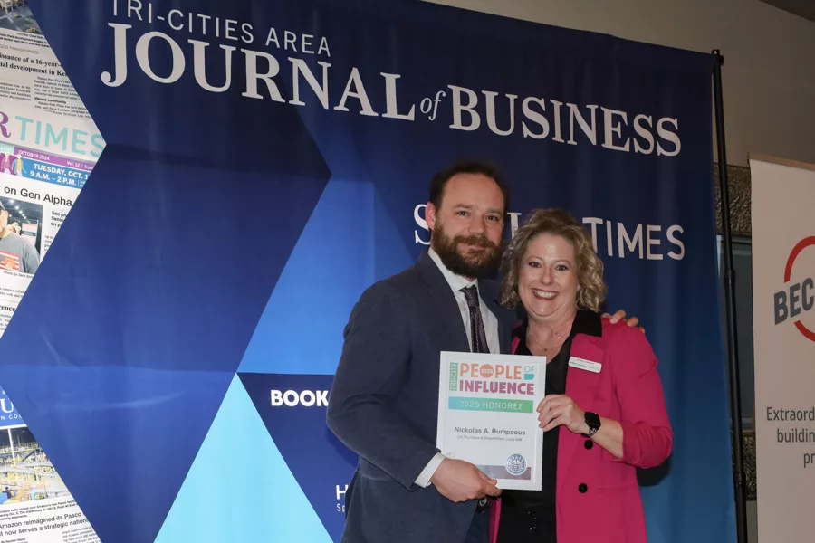 Nickolas A. Bumpaous accepting award.