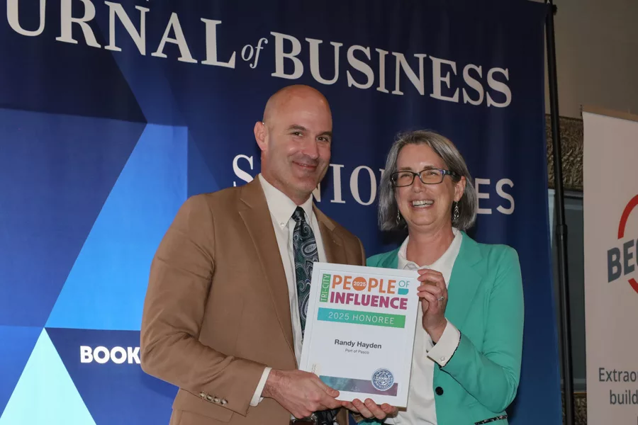 Buck Taft, Tri-Cities Airport director, accepting award for Randy Hayden.