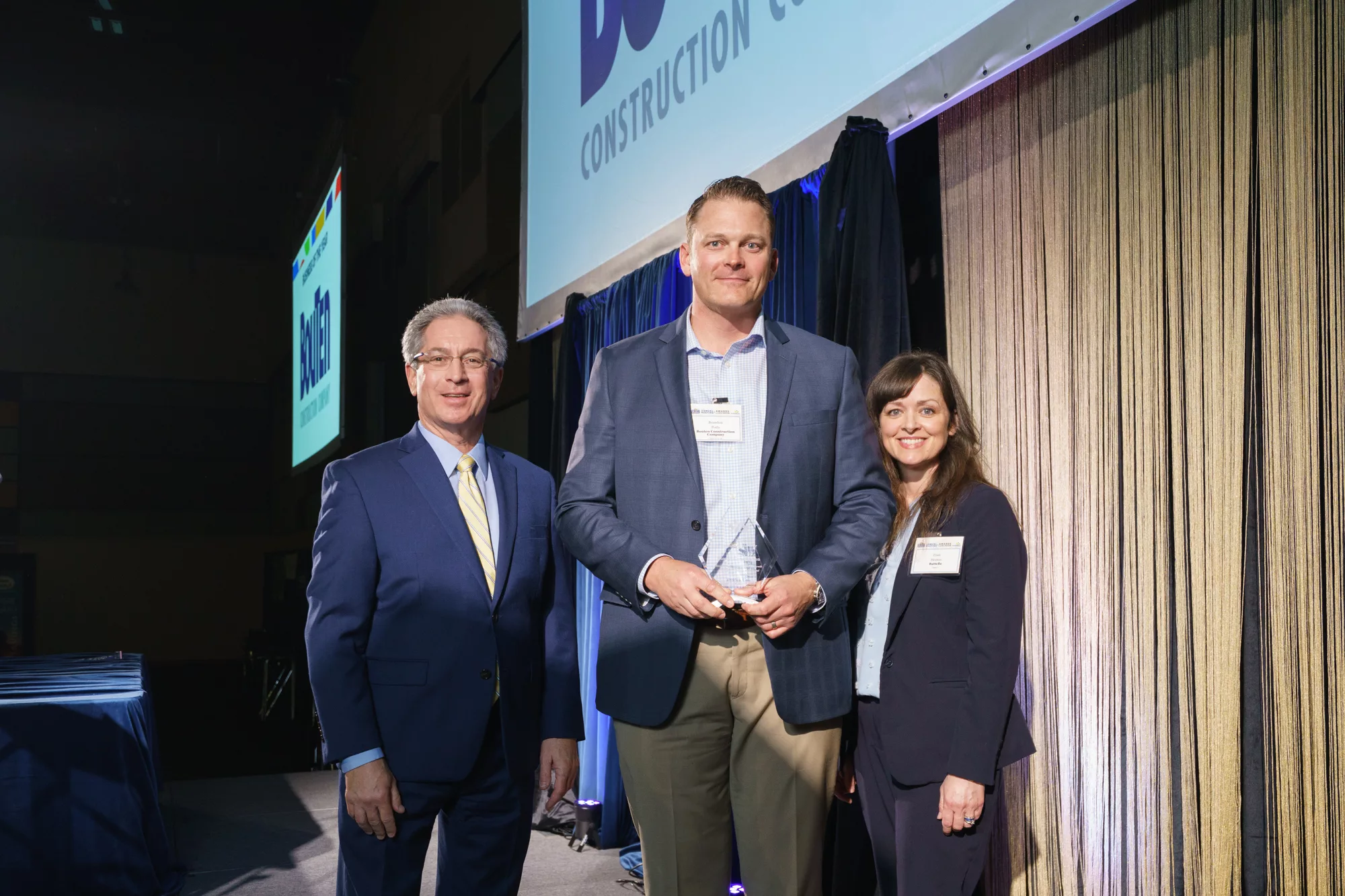 Photo of Business of the Year award winner Brandon Potts of Bouten with Dr. Steve Ashby, Pacific Northwest National Laboratory (PNNL) and Trish Herron, Tri-City Regional Chamber