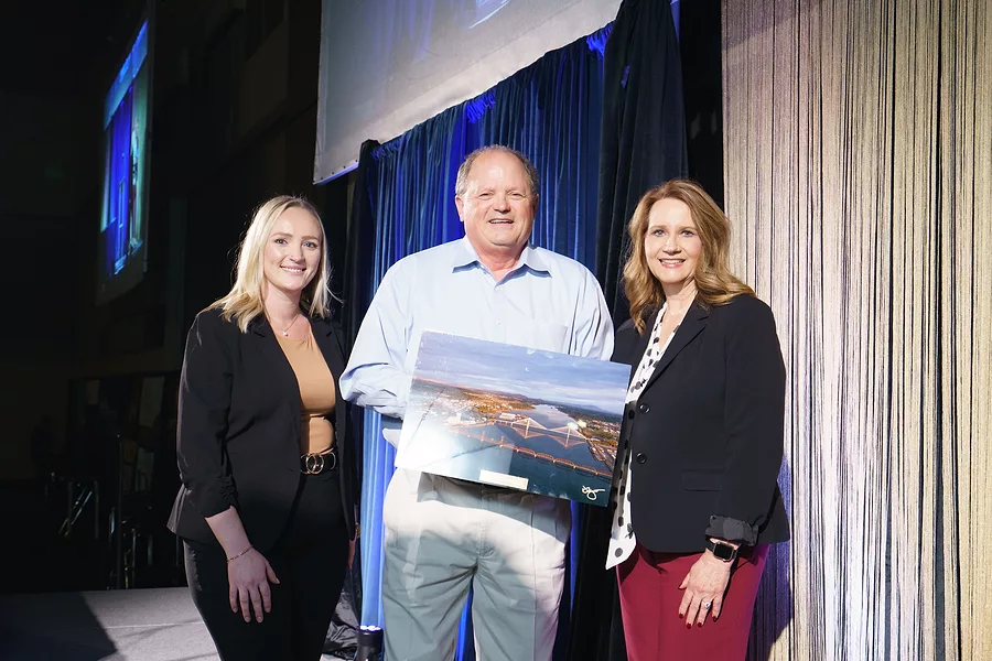 Photo of Community Impact Award winner Commissioner Jerome Delvin, Benton County with Brooklyn Reeder, Marsh McLennan Agency and Lori Mattson, Tri-City Regional Chamber
