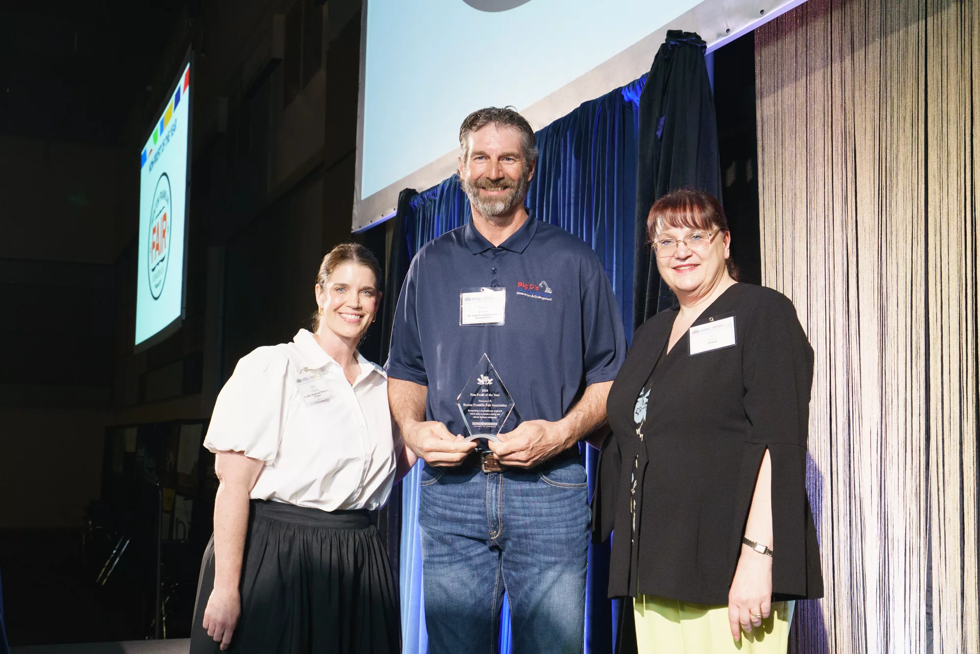 Photo of Non-Profit of the Year award winner Duane Howard, Benton Franklin Fair Association with Emily Volland, Kadlec and Amy Basche, Tri-City Regional Chamber