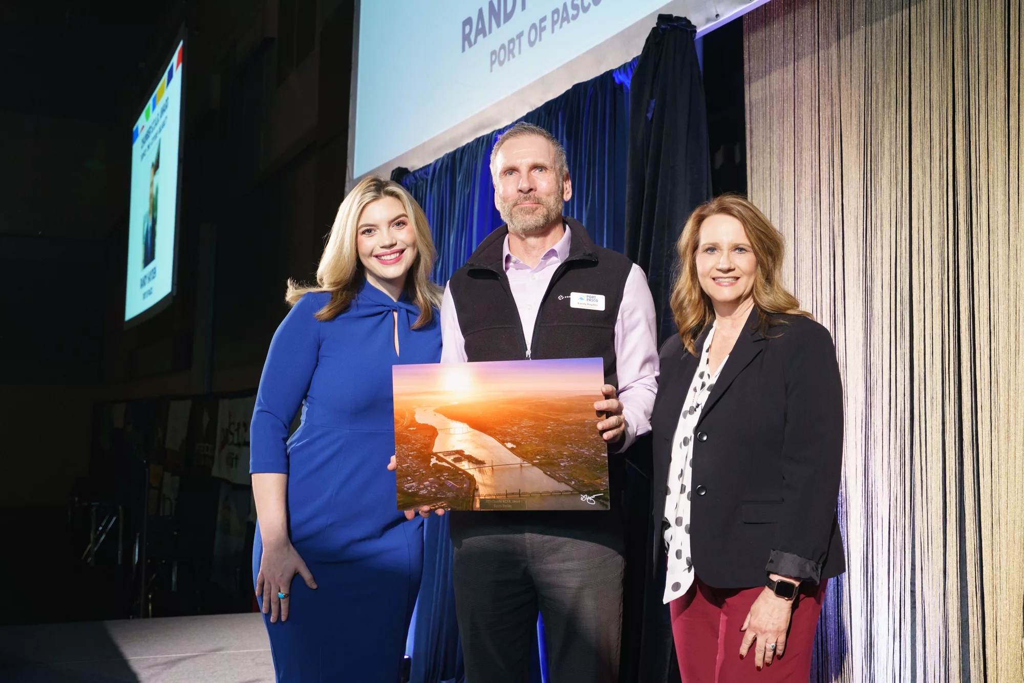 Photo of Chamber STAR award winner Randy Hayden, Port of Pasco with Ava Wainhouse, NonStop Local News and Lori Mattson, Tri-City Regional Chamber