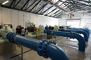 Blue water pipes in a large room
