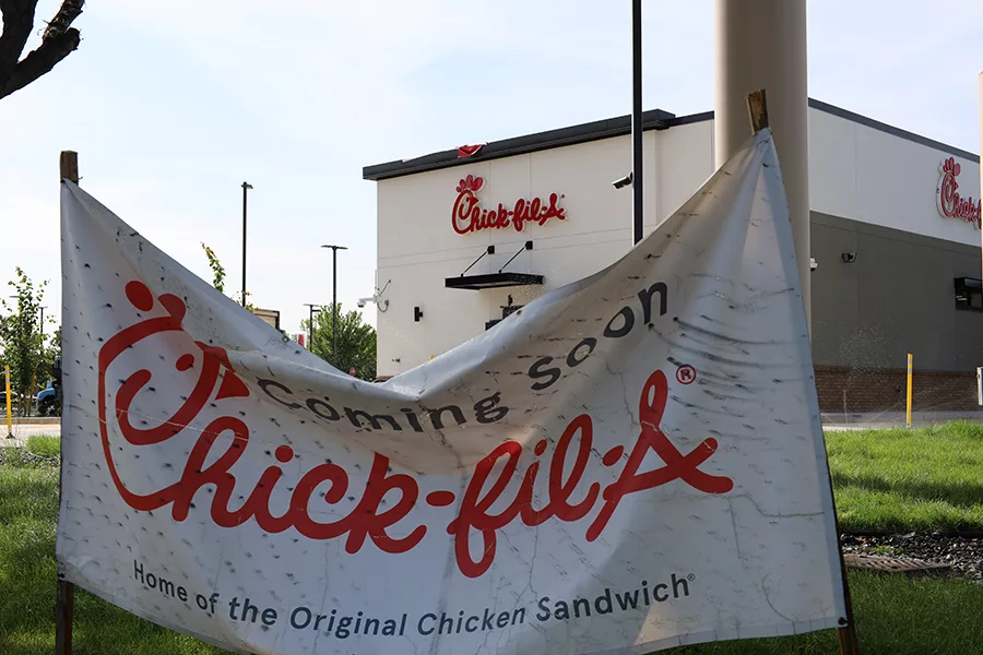 Chick-fil-A exterior and opening soon banner.