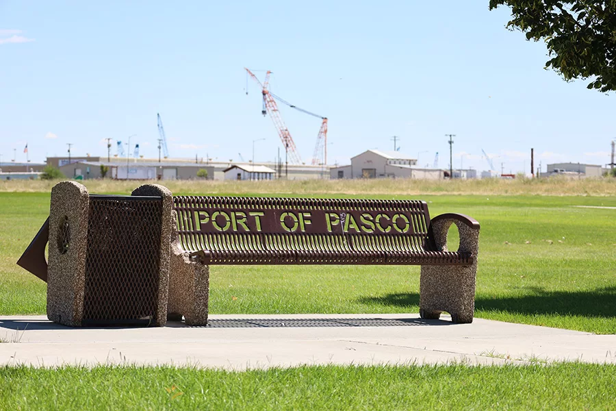 Port of Pasco bench sign with cranes in background.