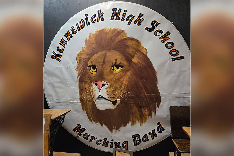 A large drum with a picture of a lion.