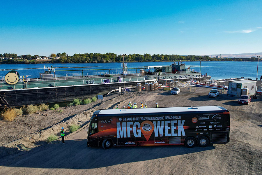 A bus near a barge.