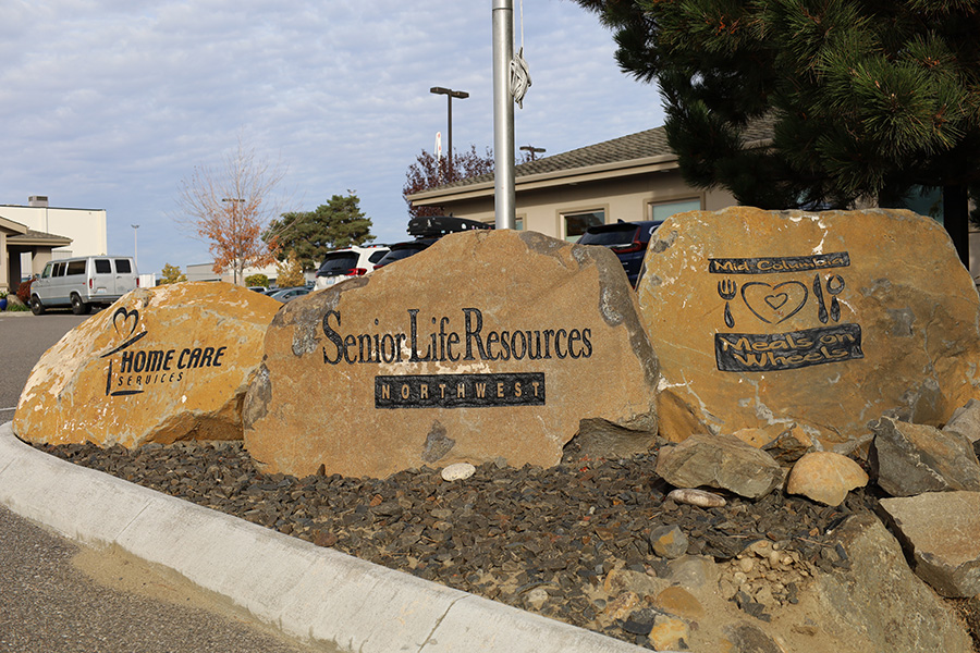 Rocks with the old Senior Life Resources logos.