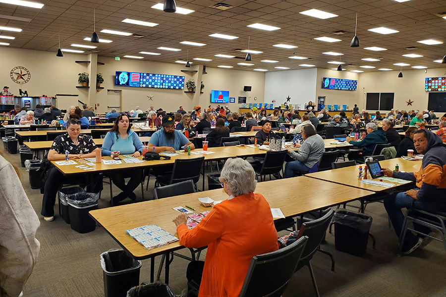 A crowd in a bingo hall.
