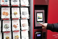 Someone using a vending machine like device.