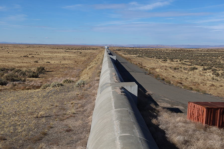 A long concrete tube stretching into the horizon.