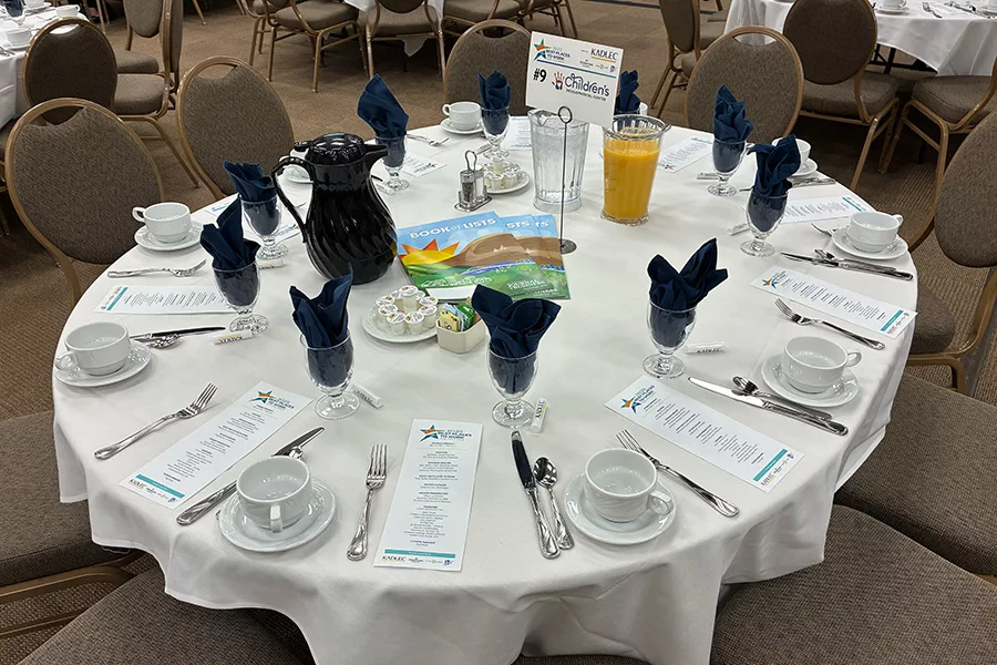 Table with cutlery and plates.