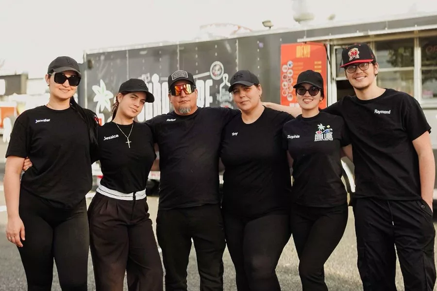 A group photo of food truck workers.