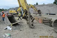 A construction site with an excavator.