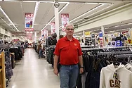 A man standing in a store.