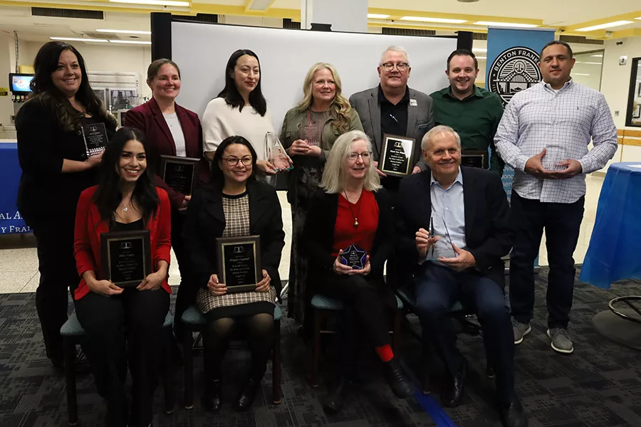 People holding awards.