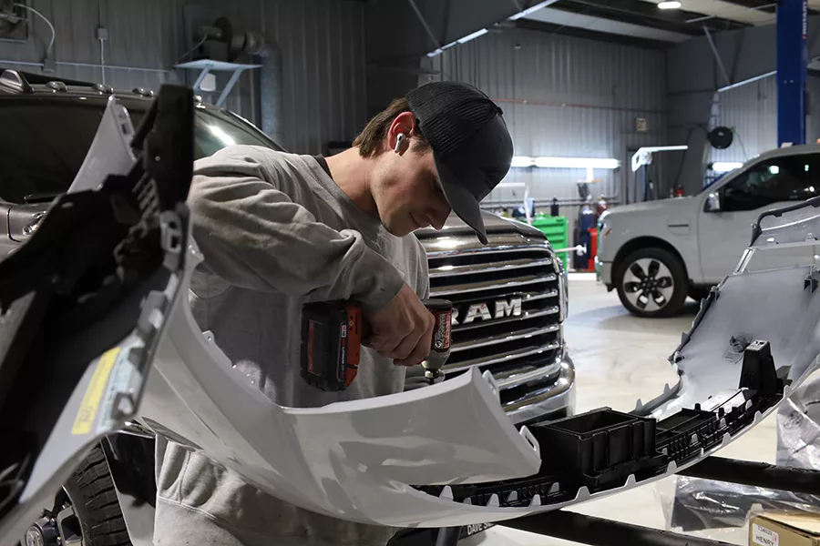 Person working on a car part.