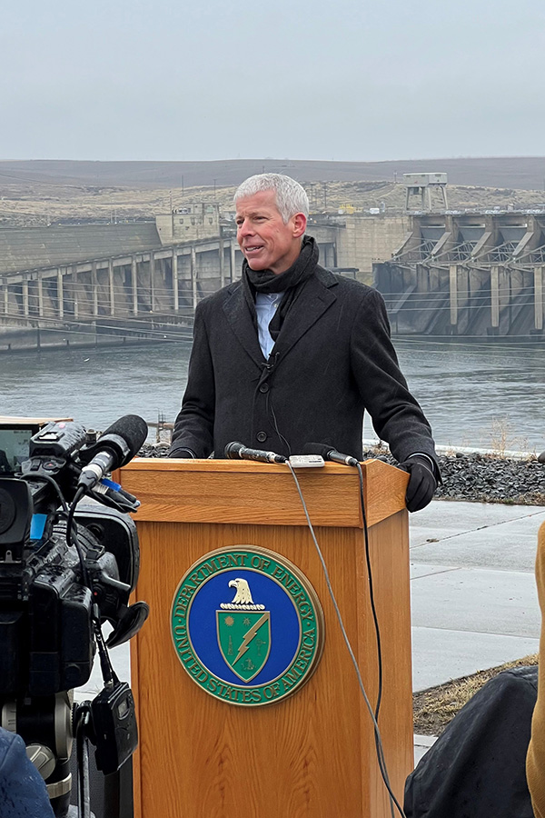Man stands behind podium.