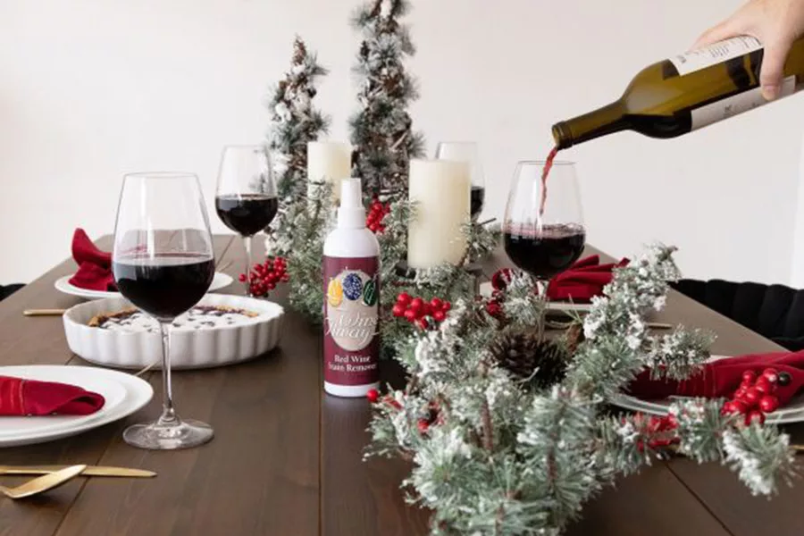 Wine bottle pouring into glasses.