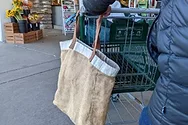 Someone carrying a reusable bag.