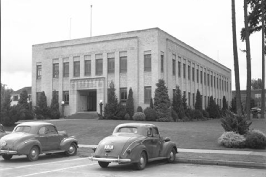 A black and white photo of the Newhouse building.