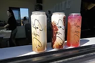Unique Sip & Co. containers which resemble transparent soda cans.
