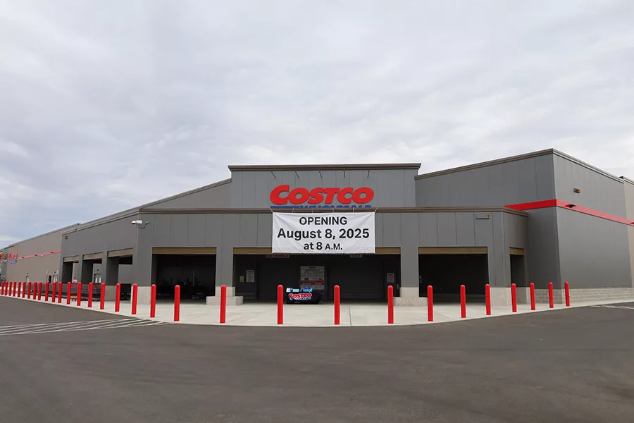 The exterior of the new Costco with a big sign that says, "Opening August 8, 2025 at 8 a.m."