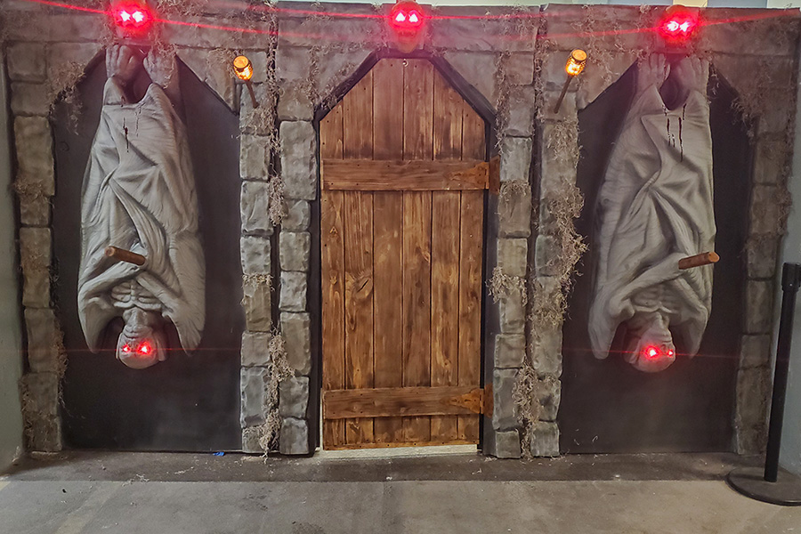 A facade with vampires hanging upside down.