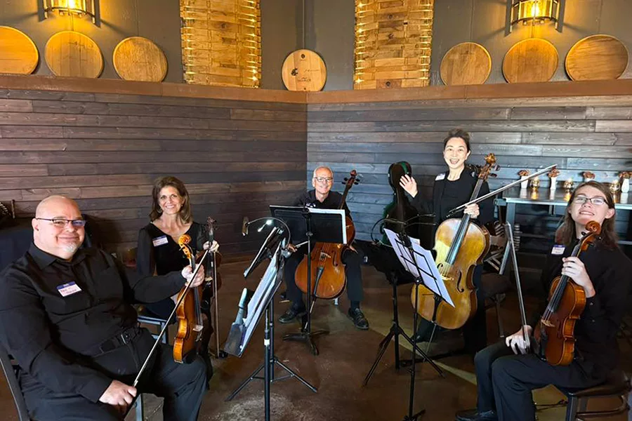 People sitting with instruments.