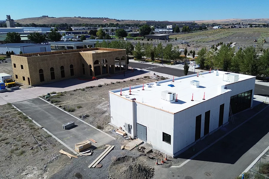 An arial view of two buildings under construction.