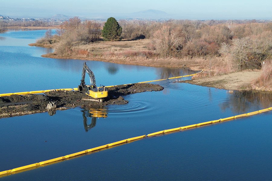 An excavator on the landbridge.