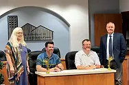 People behind a desk.