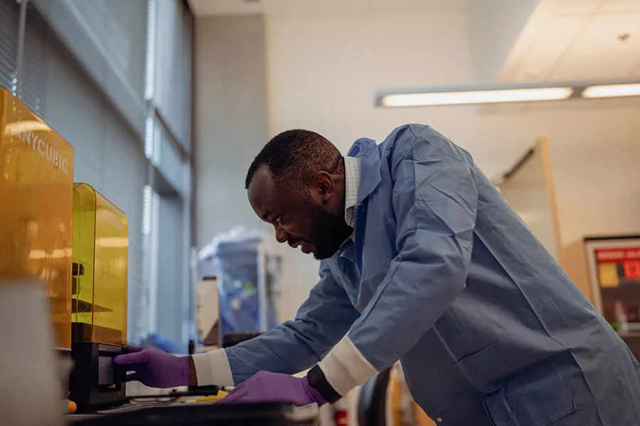 Researcher using a device.