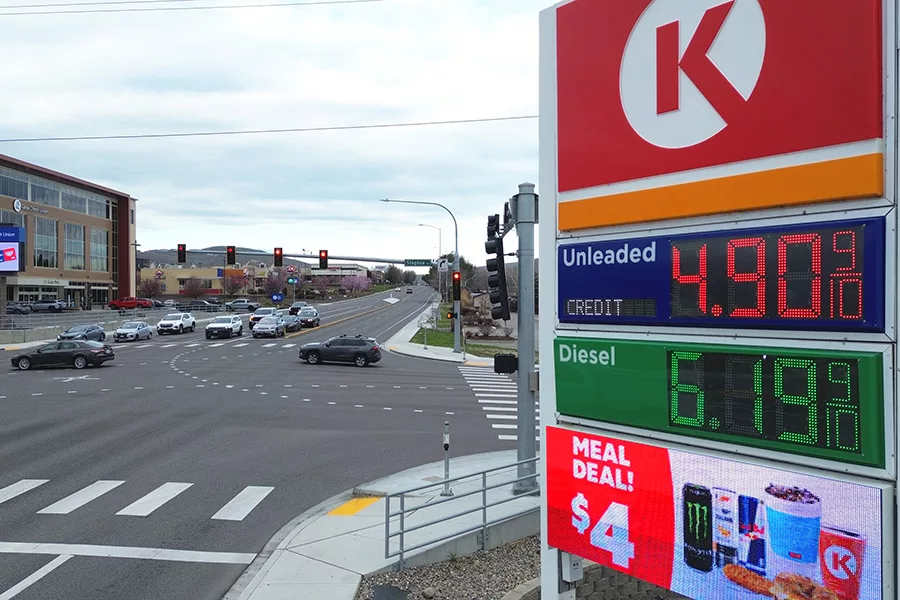 Gas sign that reads $4.90 per gallon.