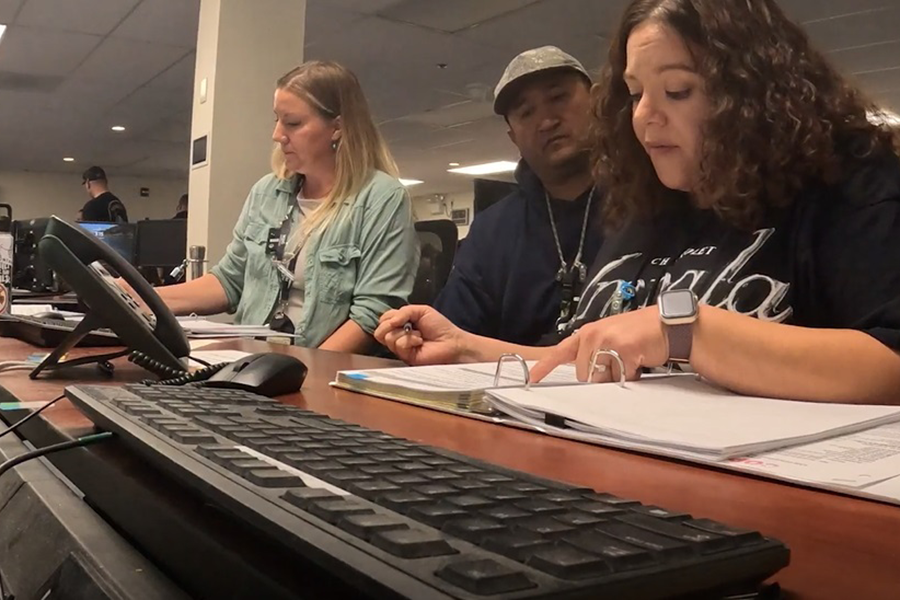 People working at a desk.