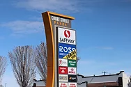 A sign showing multiple business, including Ross.