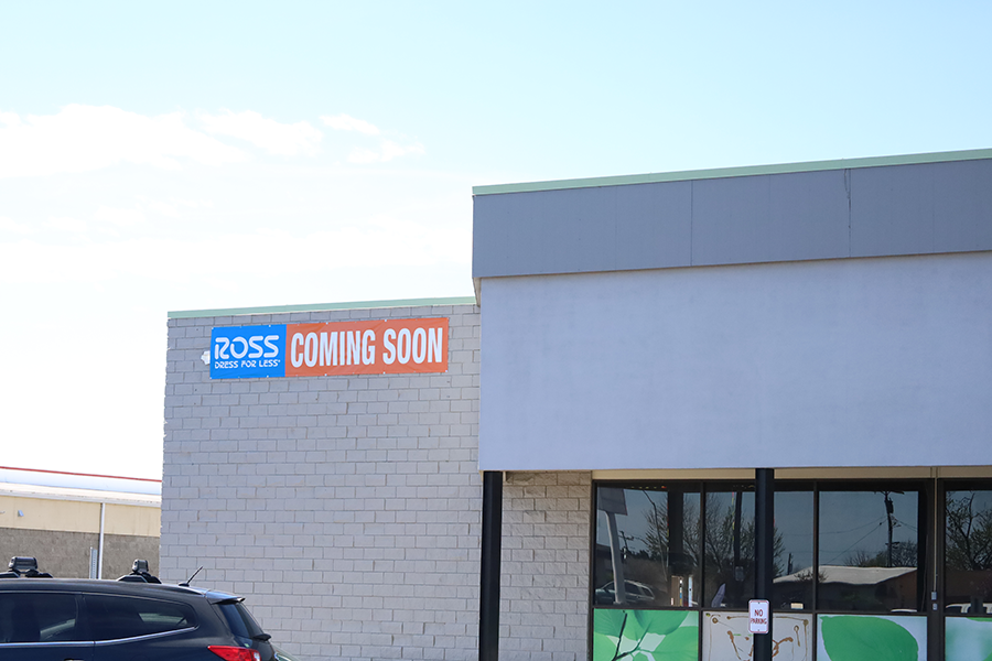 A sign that says Ross Coming soon on a building.