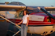 Pilot-Eden-Welch-1 Woman standing by a plane.