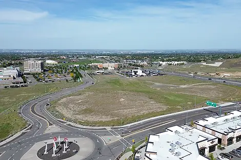 An empty lot near a roundabout.