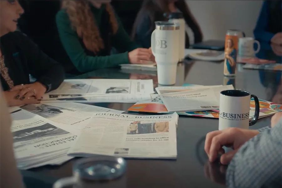 A table with the Journal of Business.