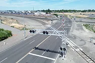 An aerial shot of a railroad crossing.