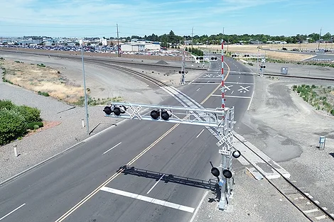 An aerial shot of a railroad crossing.